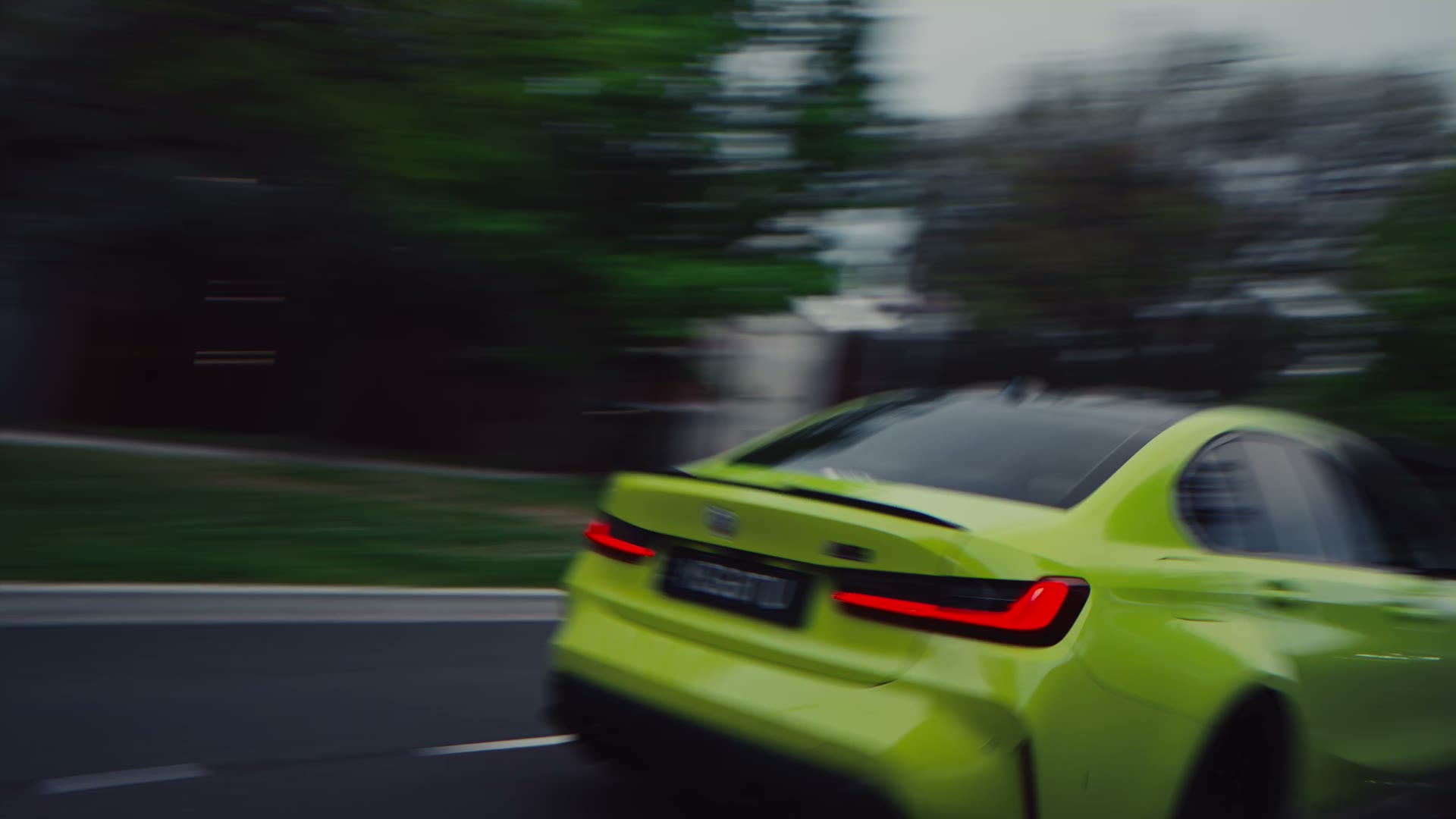 The lime green M3 pulling away down the road