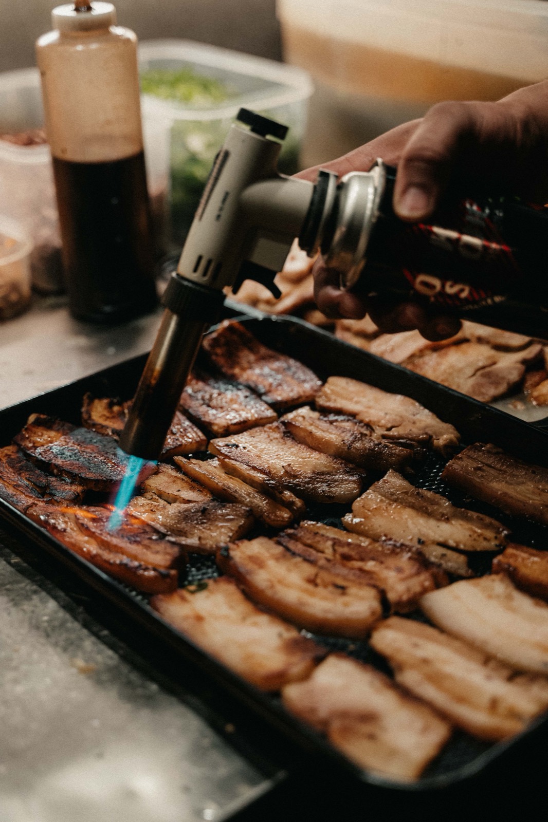 Chashu being torched on the tray at Ikigai Ramen