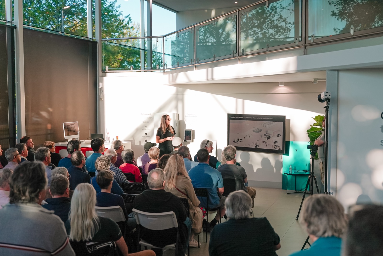 A full room listening to the talk in the Tesla showroom